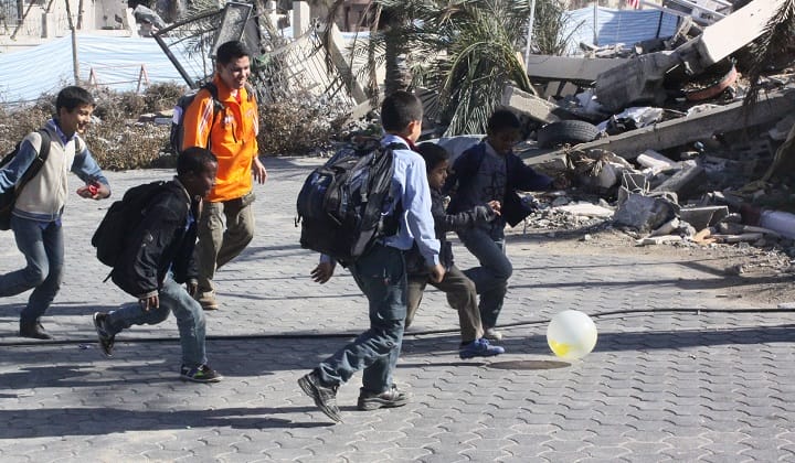 (FILE PIC) Palestinian children playing football amongst the rubble in Gaza. (Pic by Hamzah Nazari/Malay Mail)